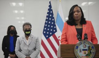 Chicago Public Schools CEO Dr. Janice Jackson, right, speaks as Chicago Mayor Lori Lightfoot, second from left, listens during a press conference at the CPS headquarters announcing a preliminary reopening framework for public schools, Friday, July 17, 2020, in Chicago. (Pat Nabong/Chicago Sun-Times via AP)  **FILE**