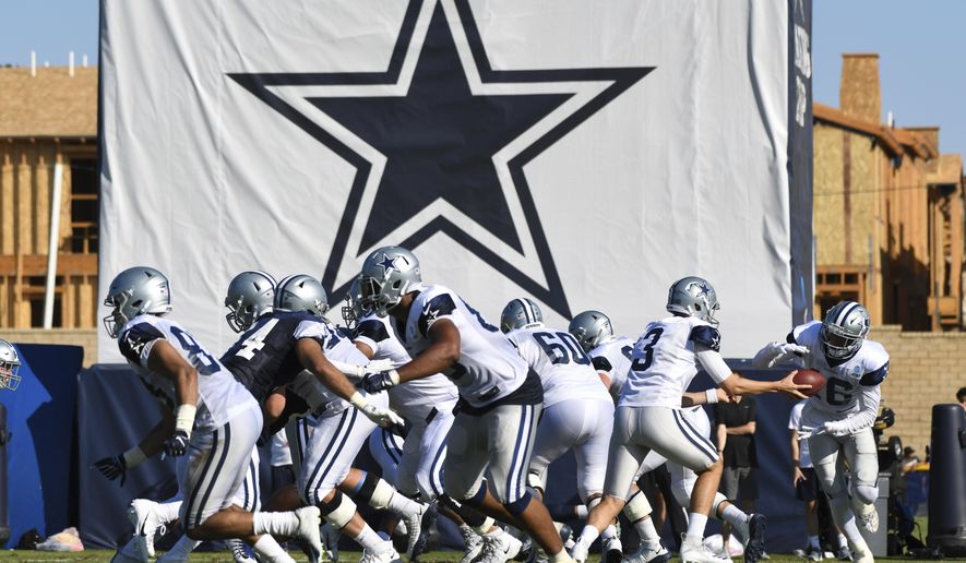 FILE - In this Monday, July 29, 2019, file photo, Dallas Cowboys practice at the NFL football team's training camp in Oxnard, Calif. The NFL has informed teams their training camps will open on time. League executive Troy Vincent sent a memo to general managers and head coaches on Saturday, July 18, 2020 informing them rookies are to report by Tuesday, quarterbacks and injured players by Thursday and all other players should arrive by July 28. (AP Photo/Michael Owen Baker, File)