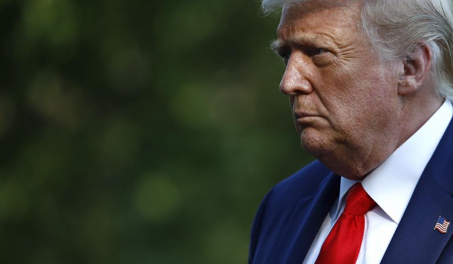 FILE - In this July 15, 2020, file photo President Donald Trump walks on the South Lawn of the White House in Washington after stepping off Marine One. Trump’s pledge to rollback an Obama-era effort to eliminate racial disparities in America’s suburbs is drawing harsh criticism from fair housing advocates, who call it a blatant attempt at racial politics and an appeal to white votes before the November election. (AP Photo/Patrick Semansky, File)