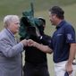 Ryan Palmer, right, fist bumps Jack Nicklaus after the final round of the Memorial golf tournament, Sunday, July 19, 2020, in Dublin, Ohio. (AP Photo/Darron Cummings)