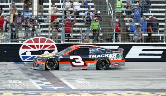 Austin Dillon crosses the finish line to win the NASCAR Cup Series auto race at Texas Motor Speedway in Fort Worth, Texas, Sunday, July 19, 2020. (AP Photo/Ray Carlin)