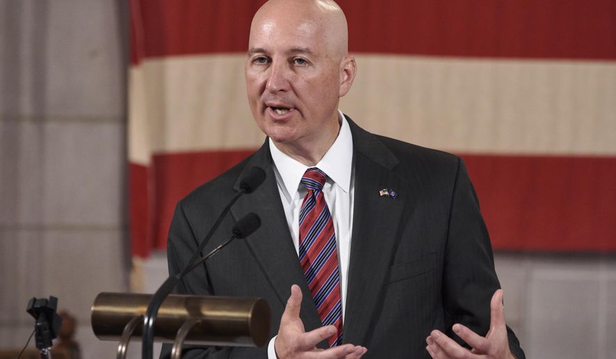 Nebraska Gov. Pete Ricketts speaks in Lincoln, Neb., Monday, July 20, 2020. Nebraska residents who qualify for expanded Medicaid under the federal health care law can start enrolling next month, Gov. Pete Ricketts said as he defended the state's nearly two-year ramp-up to offer coverage after voters approved it. (AP Photo/Nati Harnik)