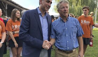 Republican U.S. Senate candidate Manny Sethi shakes hands with Republican Sen. Rand Paul, of Kentucky, during a campaign event Saturday, July 18, 2020, in Lascassas, Tenn. (AP Photo/Jonathan Mattise)