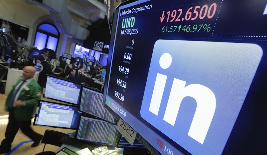 In this Monday, June 13, 2016, file photo, the LinkedIn logo appears on a screen at the post where it trades on the floor of the New York Stock Exchange. (AP Photo/Richard Drew) ** FILE **