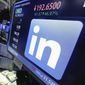In this Monday, June 13, 2016, file photo, the LinkedIn logo appears on a screen at the post where it trades on the floor of the New York Stock Exchange. (AP Photo/Richard Drew) ** FILE **