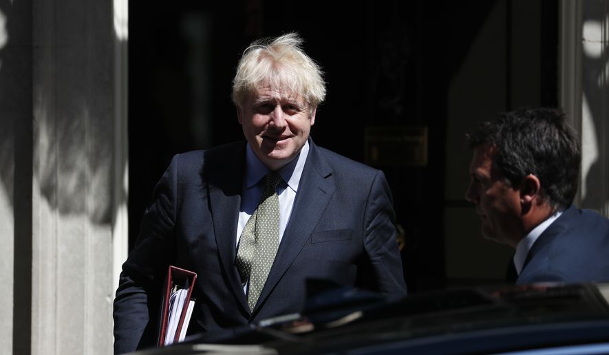 Britain&#x27;s Prime Minister Boris Johnson leaves 10 Downing Street for the House of Commons for his weekly Prime Minster&#x27;s Questions in London, Wednesday, July 22, 2020. (AP Photo/Alastair Grant)