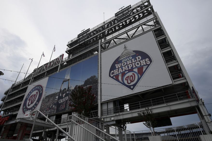 A 2019 World Series champions sign is displayed at Nationals Park, Wednesday, July 22, 2020 in Washington. (AP Photo/Nick Wass)