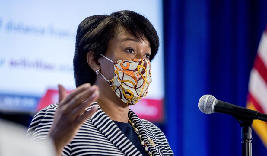 District of Columbia Mayor Muriel Bowser wears a face mask to protect against the spread of the coronavirus outbreak, as she speaks at a news conference on the coronavirus and the District's response, Monday, July 20, 2020 in Washington. In the face of newly rising infection numbers, Bowser says she'll issue an executive order making face masks mandatory outside the home. (AP Photo/Andrew Harnik)