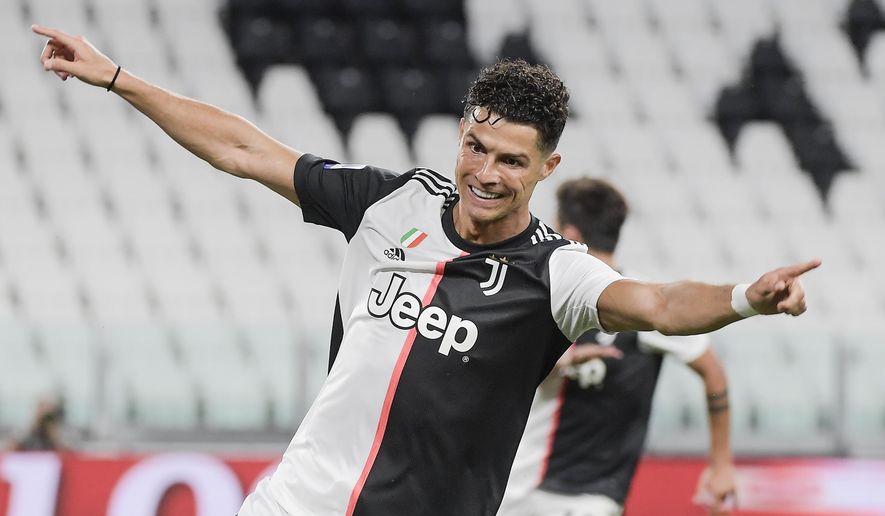 Juventus' Cristiano Ronaldo celebrates after scoring during the Italian Serie A soccer match between Juventus and Lazio at the Allianz stadium in Turin, Italy, Monday, July 20, 2020. (Marco Alpozzi/LaPresse via AP)