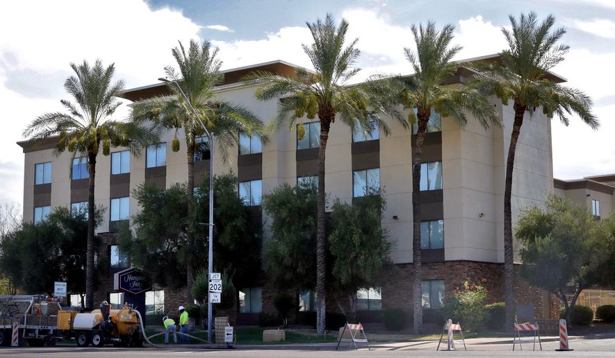 A Hampton Inn is shown Tuesday, July 21, 2020, in Phoenix. The Trump administration is detaining immigrant children as young as 1 in hotels before deporting them to their home countries. Documents obtained by The Associated Press show a private contractor hired by U.S. Immigration and Customs Enforcement is taking children to three Hampton Inns in Arizona and Texas under restrictive border policies implemented during the coronavirus pandemic. (AP Photo/Matt York)