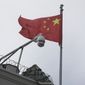 The flag of China flies behind a security camera over the Chinese Consulate in San Francisco, Thursday, July 23, 2020. San Francisco&#x27;s government raised the Chinese flag over city hall (not pictured) last week to mark the founding of the People&#x27;s Republic of China 73 years ago. (AP Photo/Jeff Chiu)