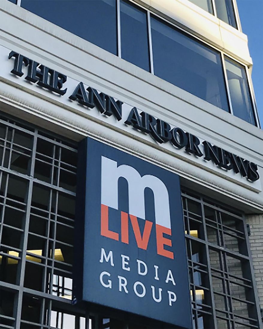 FILE- In an undated file photo provided by MLive Media Group, the exterior of The Ann Arbor News is shown. The chain of eight Michigan newspapers says it will stop publishing mug shots of people charged with crimes except in extraordinary cases as it seeks to stop perpetuating negative perceptions of people, especially minorities. John Hiner, vice president of content at MLive Media Group, says the photos imply guilt long before trial. Mug shots are jail photos of people charged with crimes. MLive publishes The Ann Arbor News as well as other Michigan newspapers. (The Ann Arbor News/MLive.com via AP)