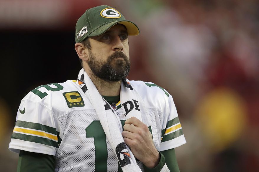 FILE - In this Jan. 19, 2020, file photo, Green Bay Packers quarterback Aaron Rodgers (12) watches from the sideline during the first half of the NFL NFC Championship football game against the San Francisco 49ers in Santa Clara, Calif. Some players surely flourished and others most certainly floundered when the COVID-19 crisis forced teams to replace their regular offseason programs with virtual OTAs and videoconference. (AP Photo/Ben Margot, File)