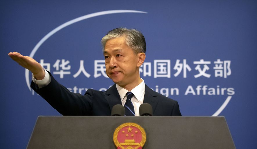 China's Ministry of Foreign Affairs spokesperson Wang Wenbin gestures during a daily briefing at the Ministry of Foreign Affairs in Beijing, Friday, July 24, 2020. China ordered the United States on Friday to close its consulate in the western city of Chengdu, ratcheting up a diplomatic conflict at a time when relations have sunk to their lowest level in decades. (AP Photo/Mark Schiefelbein)