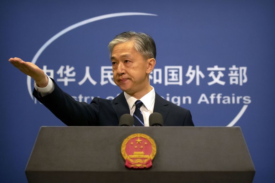 China's Ministry of Foreign Affairs spokesperson Wang Wenbin gestures during a daily briefing at the Ministry of Foreign Affairs in Beijing, Friday, July 24, 2020. China ordered the United States on Friday to close its consulate in the western city of Chengdu, ratcheting up a diplomatic conflict at a time when relations have sunk to their lowest level in decades. (AP Photo/Mark Schiefelbein)