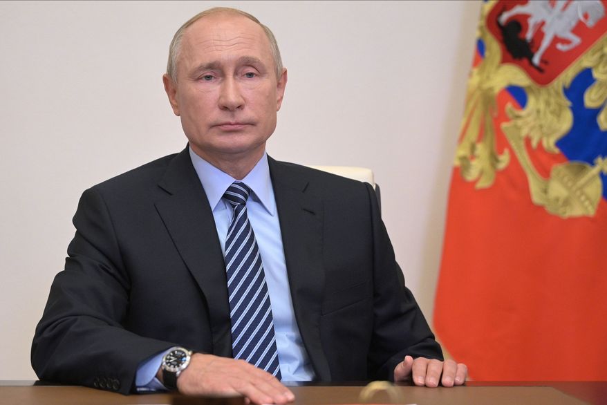 Russian President Vladimir Putin chairs a Security Council meeting via video conference at the Novo-Ogaryovo residence outside Moscow, Russia, Friday, July 24, 2020. (Alexei Druzhinin, Sputnik, Kremlin Pool Photo via AP)