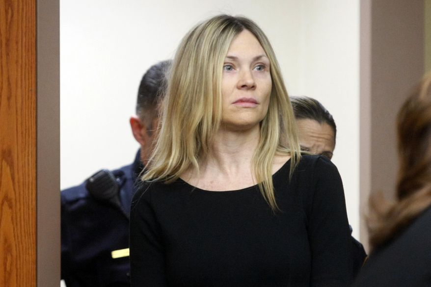 FILE - This Feb. 14, 2013 file photo shows Amy Locane Bovenizer entering the courtroom to be sentenced in Somerville, N.J. On Friday, July 24, 2020, the former &amp;quot;Melrose Place&amp;quot; actress could go back to prison even though she has already served a sentence for a fatal drunken driving crash, after an appeals court ruling this week. (AP Photo/The Star-Ledger, Patti Sapone, Pool, FIle)