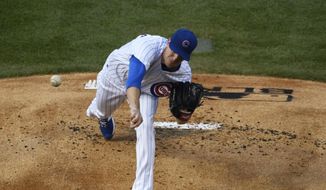Chicago Cubs starting pitcher Kyle Hendricks throws the ball during the first inning against the Milwaukee Brewers during an opening day baseball game Friday, July, 24, 2020, in Chicago. (AP Photo/David Banks)