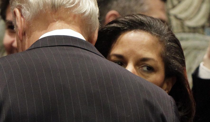 FILE - In this Dec. 15, 2010, file photo Susan Rice, the U.S. ambassador to the United Nations, whispers in the ear of Vice President Joe Biden in the United Nations Security Council, at U.N. headquarters. Democratic presidential nominee Joe Biden is in the final stages of selecting his running mate. Among the contenders is Susan Rice, who worked closely with Biden in the Obama administration and regularly briefed him on pressing foreign policy matters when she served as national security adviser. (AP Photo, File)
