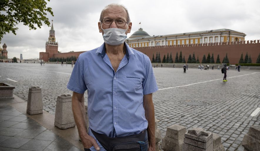 Vladimir Ignatyev, 73, speaks while at Red Square in Moscow, Russia, on Tuesday, July 21, 2020. The only person who was wearing a mask while talking to the AP at Red Square was Vladimir Ingatyev. For him, it's not just about his safety, but also about the safety of others. "You want to treat people like you'd want them to treat you – so you've got to wear one," Ignatyev said. (AP Photo/Alexander Zemlianichenko).