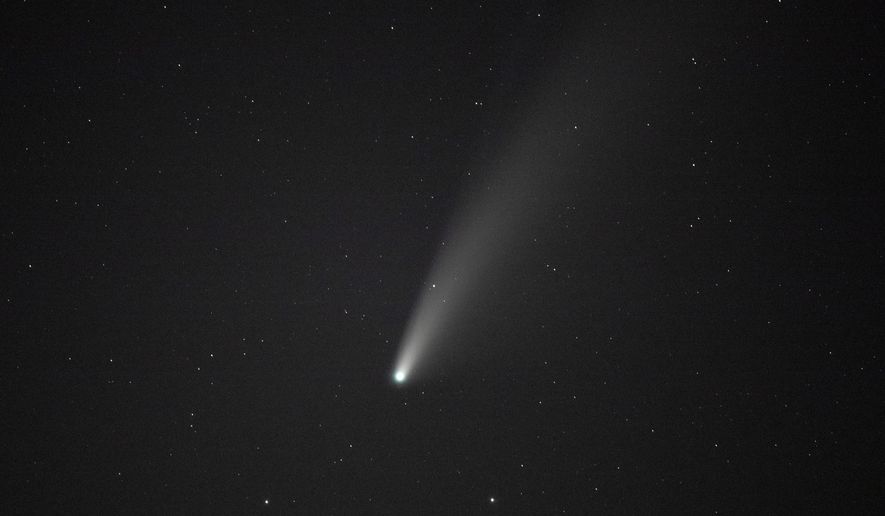 Comet NEOWISE is seen from Grandfather Mountain in Linville, N.C., Saturday, July 18, 2020. A different comet not pictured here, C/2022 E3 (ZTF), will pass the Sun at its closest point Thursday, letting it possibly become visible to observers in the Northern Hemisphere while the sky is clear and dark. (AP Photo/Gerry Broome)