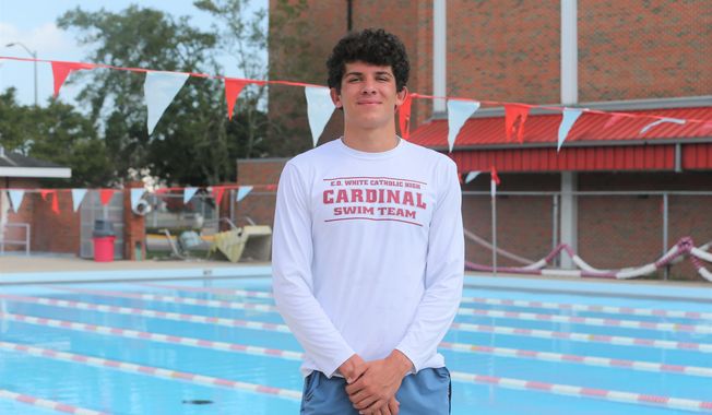 E.D. White, Catholic senior swimmer Jacques Rathle poses for a photo after a swimming practice held at the Nicholls State University pool on July 9, 2020 in Thibodaux, La. He is hoping to lead the Cardinals&#x27; boys swimming team to their fourth straight state championship this fall. (Chris Singleton/The Courier via AP)