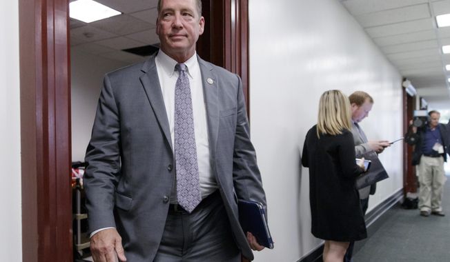 FILE - In this March 28, 2017, file photo, Rep. Ted Yoho, R-Fla., leaves a closed-door strategy session at the Capitol in Washington. A nonpartisan Christian organization that seeks to end hunger said Saturday, July 25, 2020, it asked for and received the resignation of Yoho from its board of directors following what it called his “verbal attack” on Rep. Alexandria Ocasio-Cortez. (AP Photo/J. Scott Applewhite, File)