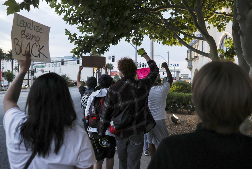 People march during a Black Lives Matter protest near UNLV, Tuesday, June 2, 2020, in Las Vegas. Top administrators at UNLV say they'll act on recommendations from an Anti-Black Racism Task Force formed in June to address social unrest following the death of George Floyd in police custody in Minnesota. (Chase Stevens/Las Vegas Review-Journal via AP)