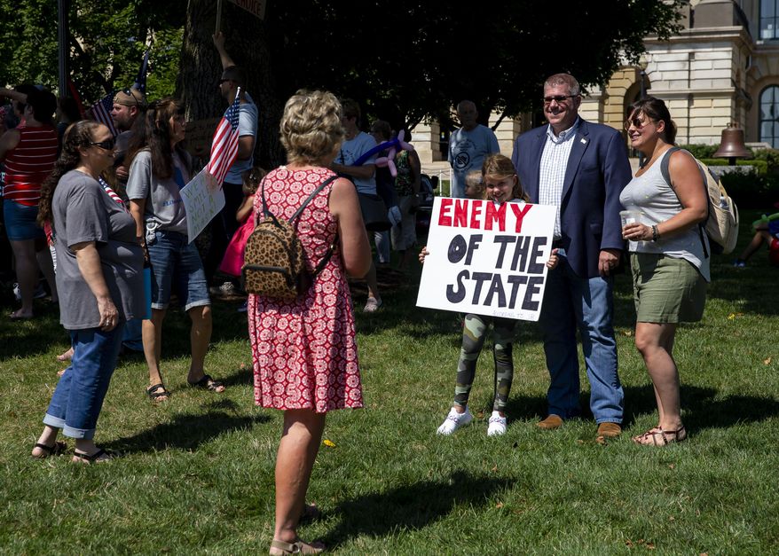 Illinois State Rep. Darren Bailey, R-Xenia, poses for a picture during the "Million Unmasked March" rally at the Illinois State Capitol, Saturday, July 25, 2020, in Springfield, Ill. The protesters gathered in front of the Abraham Lincoln Statue to voice their opposition to guidelines that children be required to wear face masks when they return to school during the COVID-19 pandemic. (Justin L. Fowler/The State Journal-Register via AP)