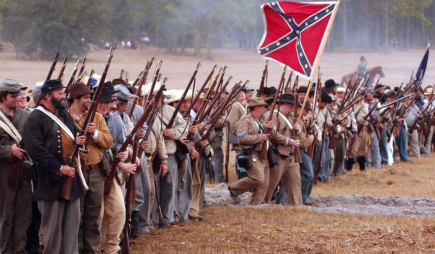 In a reenactment, Confederate troops advance to meet the attacking Union army during the battle at the Brooksville Raid, Saturday, Jan. 19, 2008, in Brooksville, Fla. The two-day event commemorates the 1864 attack by union soldiers during the Civil War, and attracts Civil War re-enactors from as far away as Michigan. Organizers have announced that there will be no Brooksville Raid in 2021, and unless a new site is found, perhaps none in the future. (Bob East III/Tampa Bay Times via AP)