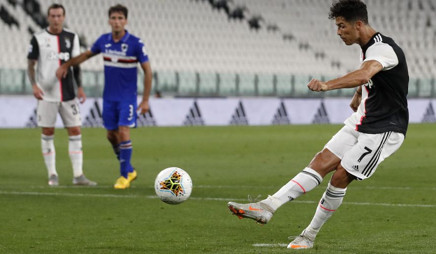 Juventus' Cristiano Ronaldo makes a penalty attempt during the Serie A soccer match between Juventus and Sampdoria at the Allianz stadium, in Turin, Italy, Sunday, July 26, 2020. (AP Photo/Antonio Calanni)