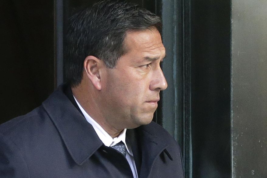 FILE - In this March 25, 2019 file photo Jorge Salcedo, former University of California at Los Angeles men's soccer coach, departs federal court in Boston, after facing charges in a nationwide college admissions bribery scandal. Salcedo, former University of California, Los Angeles men’s soccer coach, pleaded guilty Monday, July 27, 2020 to accepting $200,000 in bribes to help two students get into the school as recruits. Salcedo admitted to participating in the college admissions bribery scheme involving TV celebrities, other wealthy parents and elite universities across the country. (AP Photo/Steven Senne, File)