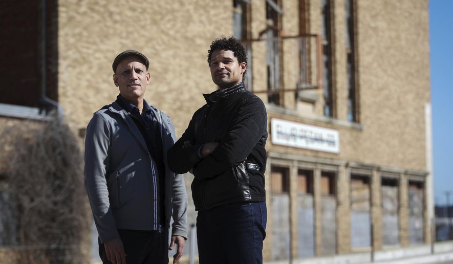 Daniel Banks, left, and Adam McKinney of DNAWORKS created the 1012 Leadership Coalition, which includes five local organizations, to save the former Ku Klux Klan Hall and transform it into an international center for arts and community healing. (Amanda McCoy/Star-Telegram via AP)