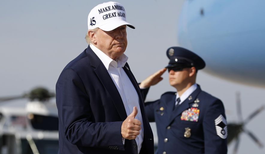 President Donald Trump gestures as he steps off Air Force One at Andrews Air Force Base, Md., Sunday, July 26, 2020. Trump is returning to Washington after spending the weekend at his golf club in Bedminster, N.J. (AP Photo/Patrick Semansky)