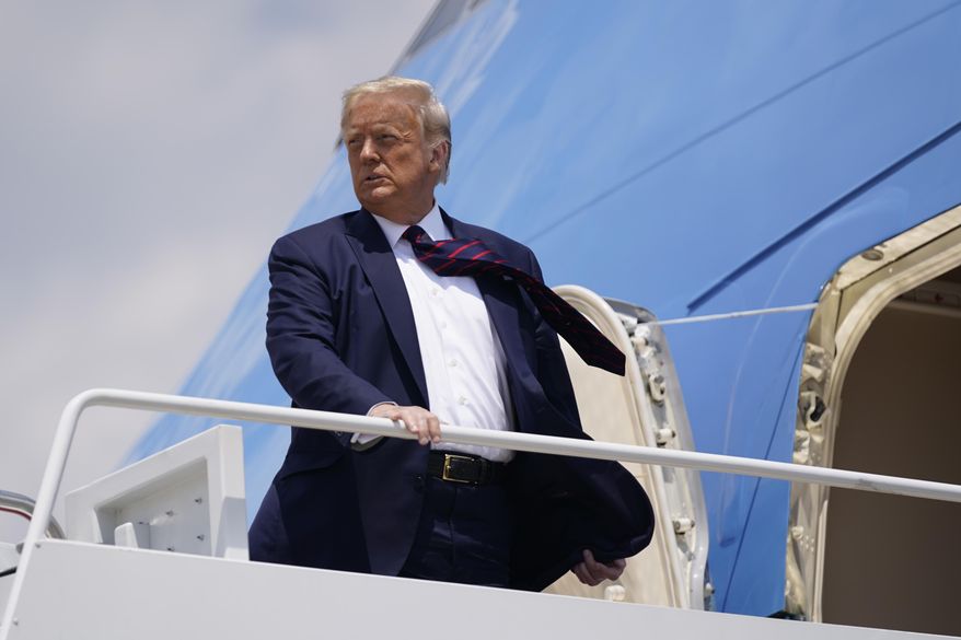 President Donald Trump boards Air Force One for a trip to visit Bioprocess Innovation Center at Fujifilm Diosynth Biotechnologies in Morrisville, N.C., Monday, July 27, 2020, in Washington. (AP Photo/Evan Vucci) **FILE**