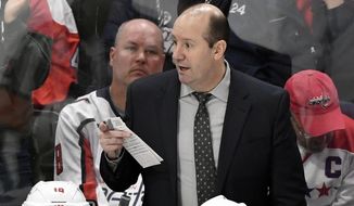 FILE - In this March 1, 2020, file photo, Washington Capitals head coach Todd Reirden watches his team play against the Minnesota Wild during the third period of an NHL hockey game in St. Paul, Minn. When Todd Reirden and Jon Cooper spent four months looking over video of the teams they coached this season, they saw almost polar opposites. Reirden&#39;s Washington Capitals started hot before their defensive game slipped. Cooper&#39;s Tampa Bay Lightning took a while to warm up, then won 14 of 21 games before the NHL season was halted in mid-March because of the COVID-19 pandemic.  (AP Photo/Hannah Foslien, File)