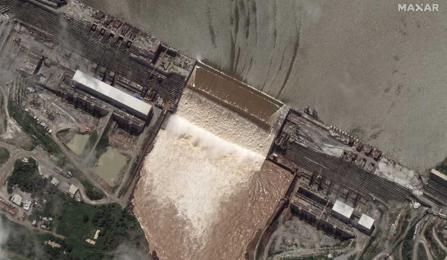 This satellite image shows the Grand Ethiopian Renaissance Dam on the Blue Nile river in the Benishangul-Gumuz region of Ethiopia on Tuesday, July 28, 2020. Ethiopia&#39;s prime minister on Wednesday, July 22, 2020 hailed the first filling of the massive dam that has led to tensions with Egypt, saying two turbines will begin generating power next year. (Maxar Technologies via AP)
