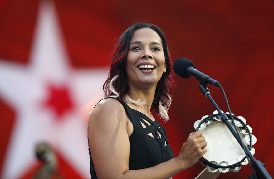 FILE - In this Tuesday, July 3, 2018, file photo, Rhiannon Giddens performs during rehearsal for the Boston Pops Fireworks Spectacular in Boston. The Grammy-winning musician is Silkroad's new artistic director, taking the baton from renowned cellist Yo-Yo Ma, who founded the group two decades ago, Silkroad said on Tuesday, July 28, 2020. The North Carolina native is the first woman and first multiracial artist to lead the Boston-based organization. (AP Photo/Michael Dwyer, File)