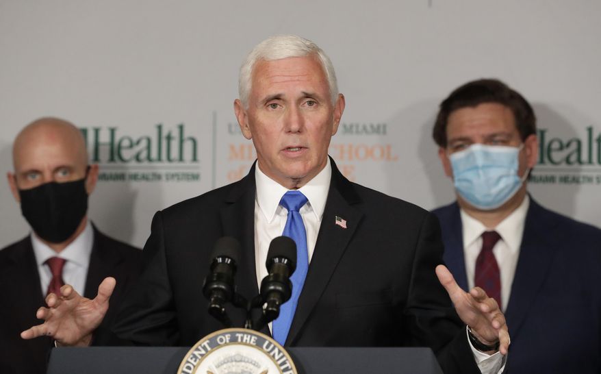 Vice President Mike Pence, center, gestures as he speaks during a news conference with Food and Drug Administration Commissioner Dr. Stephen Hahn, left, and Florida Gov. Ron DeSantis, right, at the University of Miami Miller School of Medicine Don Soffer Clinical Research Center, Monday, July 27, 2020, in Miami. Pence was in Florida to mark the beginning of Phase III trials for a coronavirus vaccine. (AP Photo/Wilfredo Lee)