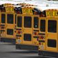 Fairfax County Public School buses are lined up at a maintenance facility in Lorton, Va., Friday, July 24, 2020. (AP Photo/J. Scott Applewhite) ** FILE **