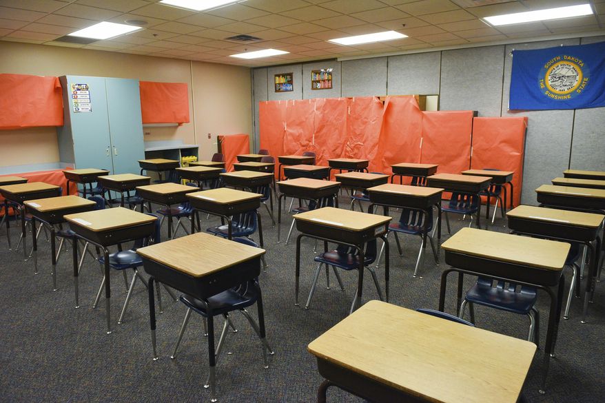 A classroom has desks arranged for in-person learning to resume in the fall on Tuesday, July 28, at John Harris Elementary School in Sioux Falls, S.D. (Erin Bormett/The Argus Leader via AP)