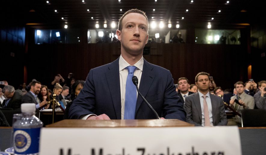 In this Tuesday, April 10, 2018, file photo, Facebook CEO Mark Zuckerberg arrives to testify before a joint hearing of the Commerce and Judiciary Committees on Capitol Hill in Washington. (AP Photo/Andrew Harnik) ** FILE **