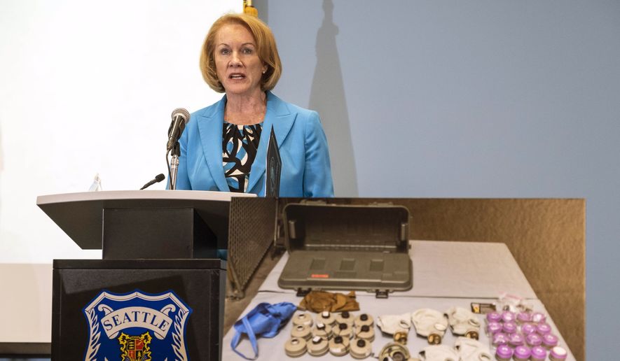 With photographs showing some of the devices recovered by Seattle Police used against officers last weekend, Mayor Jenny Durkan called for calm and a more civil approach to protest that doesn&#39;t include destruction or assault, Wednesday, July 29, 2020, in Seattle. The Seattle Police Department showed some of the incendiary devices and other tactical materials confiscated after last Saturday&#39;s riot on Capitol Hill. (Dean Rutz/The Seattle Times via AP) ** FILE **