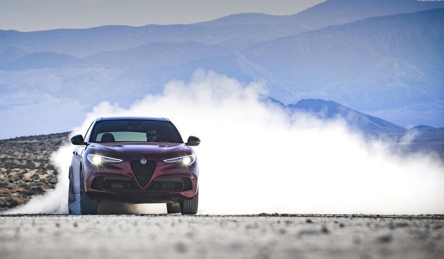 This photo provided by Fiat Chrysler Automobiles shows the 2020 Alfa Romeo Stelvio Quadrifoglio, a high-powered luxury compact crossover with a unique design and comfortable ride. (Courtesy of Fiat Chrysler Automobiles via AP)