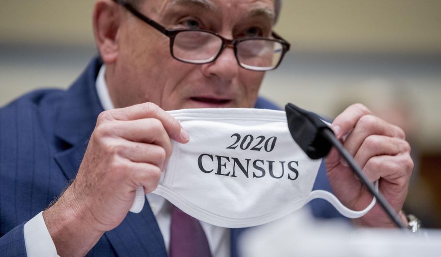 Census Bureau Director Steven Dillingham holds up his mask with the words &#39;2020 Census&#39; as he testifies before a House Committee on Oversight and Reform hearing on the 2020 Census​ on Capitol Hill, Wednesday, July 29, 2020, in Washington. (AP Photo/Andrew Harnik)