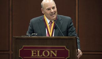 FILE - In this March 1, 2017, file photo, then Elon Trustee Louis DeJoy is honored with Elon&#x27;s Medal for Entrepreneurial Leadership in Elon. N.C. U.S. Sen. Joe Manchin and union officials say the U.S. Postal Service is considering closing post offices across the country, sparking worries ahead the anticipated surge of mail-in ballots in the 2020 elections. Manchin on Wednesday, July 29, 2020 said he has received numerous reports from post offices and colleagues about service cuts or looming closures in West Virginia and elsewhere, prompting him to send a letter to Postmaster General Louis DeJoy asking for an explanation. (Kim Walker/Elon University via AP, File)