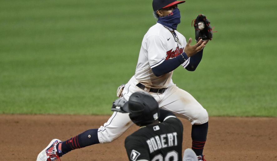 Cleveland Indians' Francisco Lindor gets Chicago White Sox's Luis Robert at second base in the seventh inning in the second baseball game of a doubleheader, Tuesday, July 28, 2020, in Cleveland. (AP Photo/Tony Dejak)