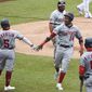 Washington Nationals second baseman Starlin Castro (No. 14) celebrates with Josh Harrison and other teammates after scoring a run against the Toronto Blue Jays on Thursday, July 30, 2020, at Nationals Park in Washington, D.C. (Photo by All-Pro Reels)