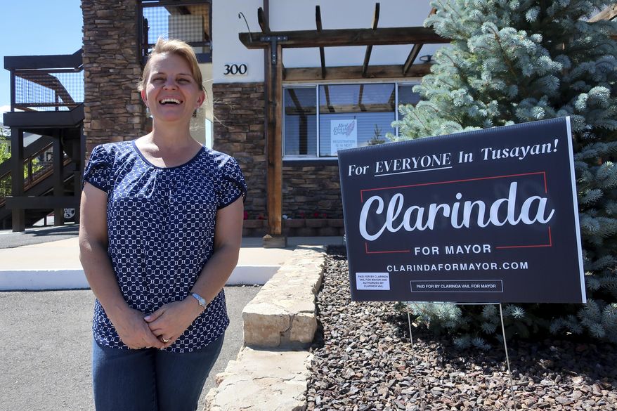 This Tuesday, July 28, 2020 photo shows mayoral candidate Clarinda Vail outside the lodge she manages in Tusayan, Ariz. About 240 residents of Tusayan are registered to vote in the primary election that will decide the mayoral race Tuesday, Aug. 4, 2020. (AP Photo/Felicia Fonseca)
