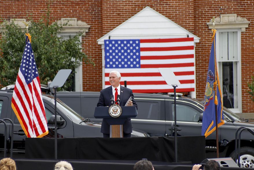 Vice President Mike Pence speaks at a "Cops for Trump" campaign event at the police station, Thursday, July 30, 2020, in Greensburg, Pa. (AP Photo/Keith Srakocic)